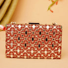 Decorative clutch bag with intricate patterns on a beige background