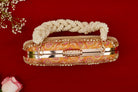 Decorative handbag with pearl handle on a red background